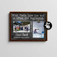 a picture frame with a picture of a group of people skiing